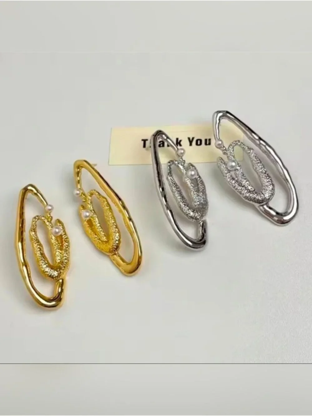 Gold tone Textured Loop Earrings with Pearl Accents